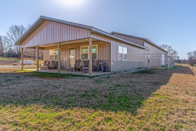 view of side of home featuring a yard