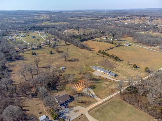 birds eye view of property with a rural view