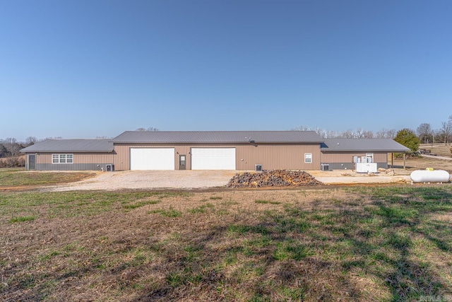 single story home featuring a garage