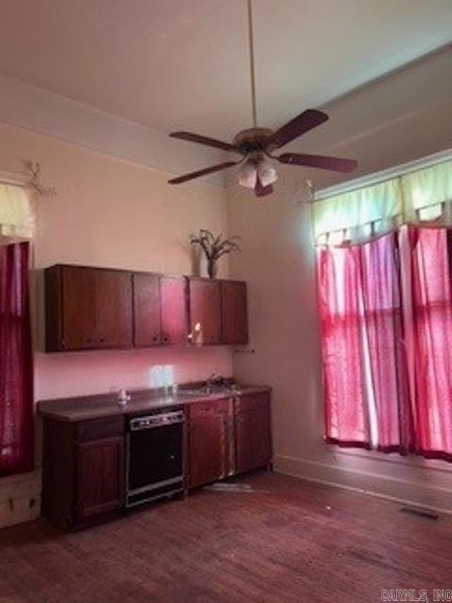 kitchen with dark wood finished floors, visible vents, dishwasher, and a ceiling fan