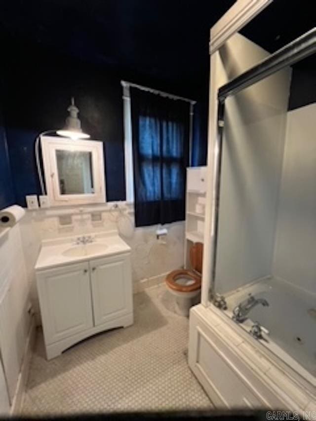 full bath with toilet, vanity, a bathtub, tile patterned flooring, and walk in shower