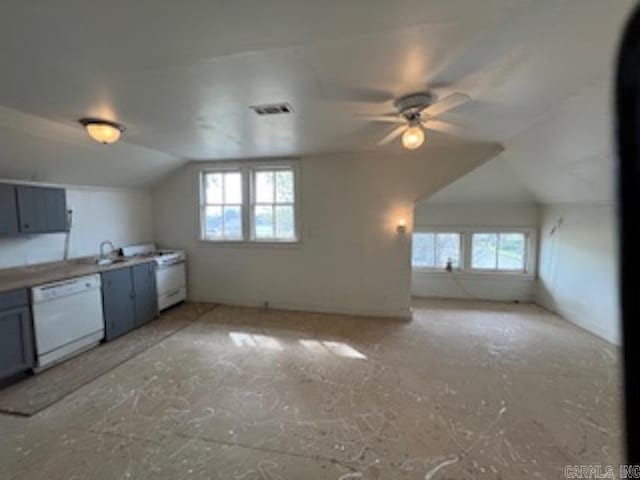 kitchen featuring a ceiling fan, dishwasher, gray cabinetry, lofted ceiling, and visible vents