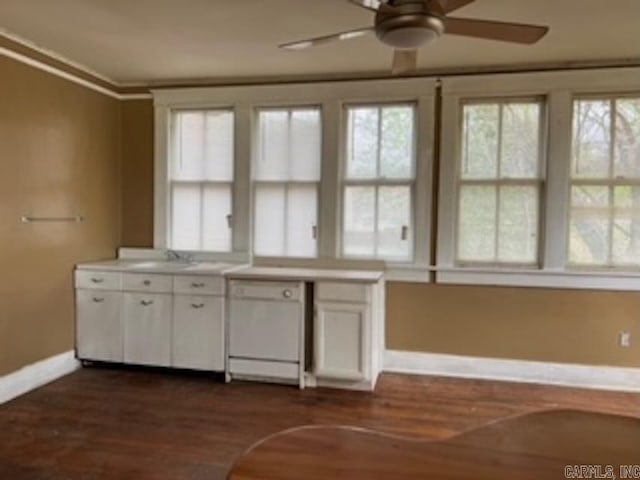 kitchen featuring dark wood-style flooring, white cabinets, crown molding, dishwasher, and a ceiling fan
