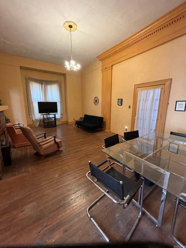 interior space with wood finished floors and an inviting chandelier