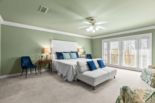 carpeted bedroom with access to exterior, visible vents, crown molding, baseboards, and french doors