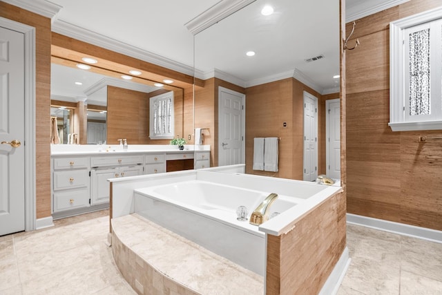 full bath with visible vents, vanity, a bath, and crown molding