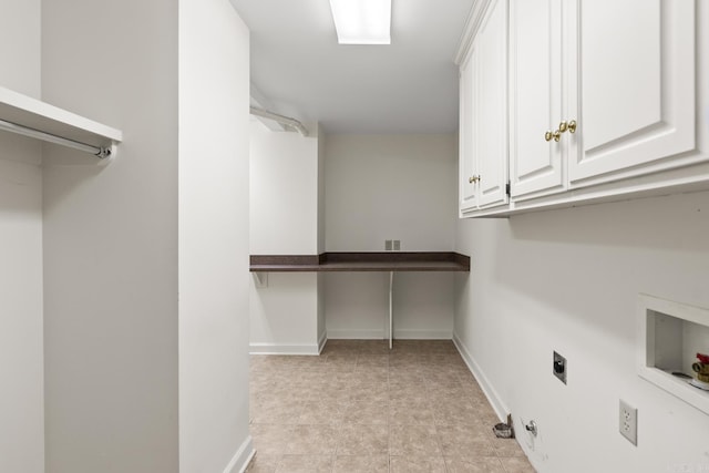 laundry room with cabinet space, hookup for an electric dryer, hookup for a washing machine, and baseboards