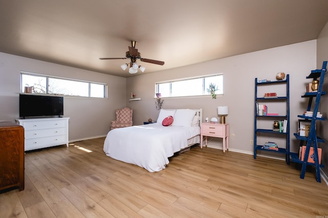 bedroom with baseboards, light wood-style floors, and ceiling fan