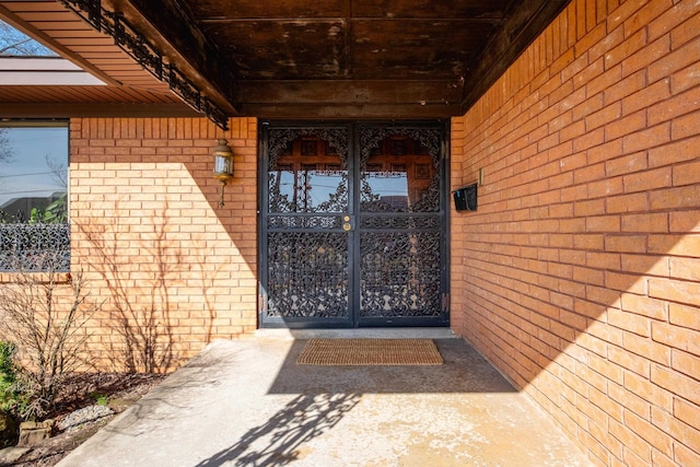 entrance to property with brick siding