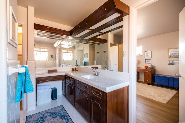 bathroom with vanity and wood finished floors