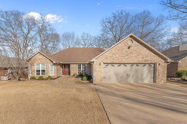 ranch-style home with brick siding, an attached garage, driveway, and a shingled roof