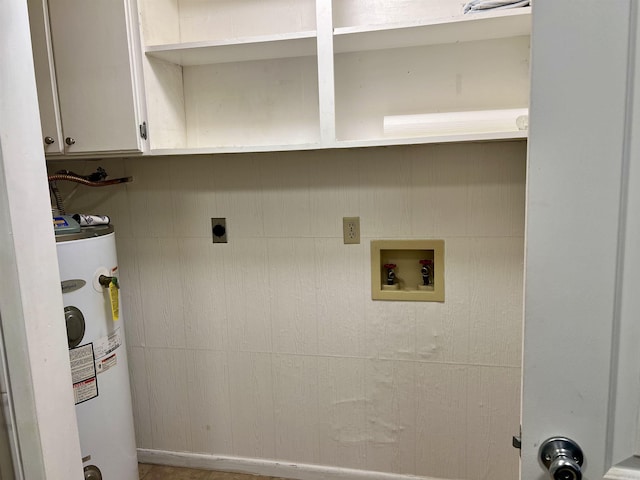 laundry area with cabinet space, electric water heater, hookup for an electric dryer, and hookup for a washing machine