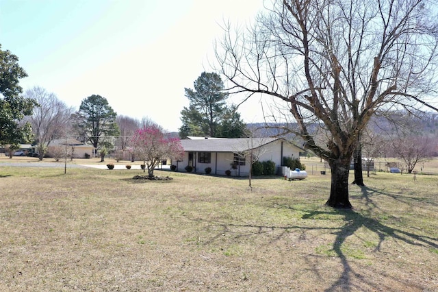 view of front facade with a garage and a front yard