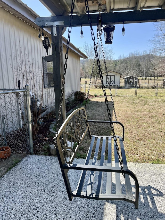 view of patio featuring fence