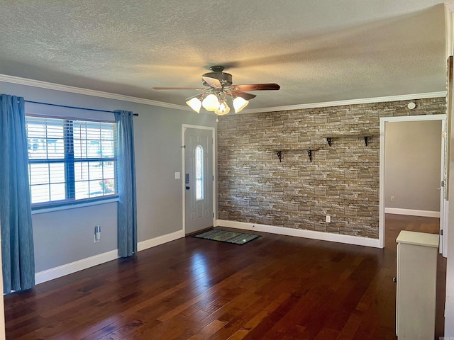 entryway featuring a textured ceiling, crown molding, a ceiling fan, and hardwood / wood-style floors