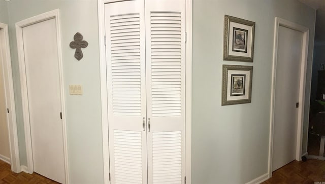 hallway featuring baseboards