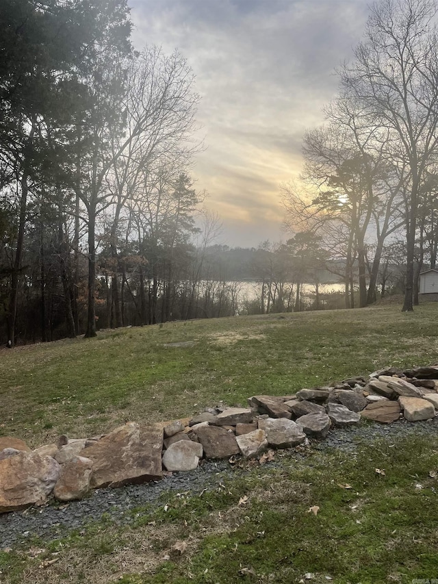 yard at dusk with an outdoor fire pit