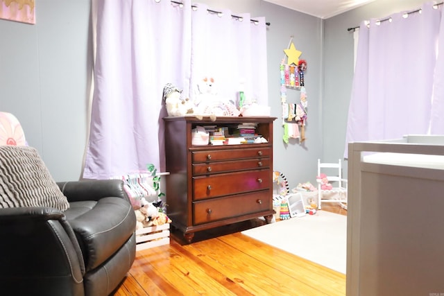 bedroom with light wood finished floors