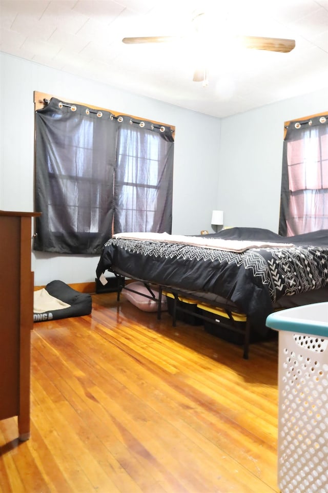 bedroom featuring ceiling fan and wood finished floors