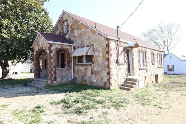 view of front of house with stone siding