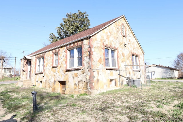 view of home's exterior with stone siding