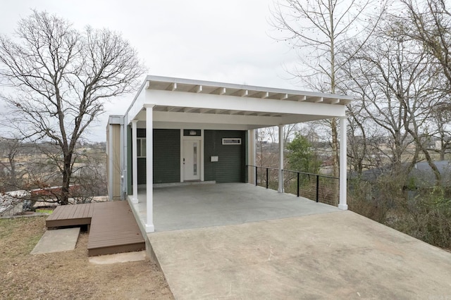 exterior space featuring concrete driveway