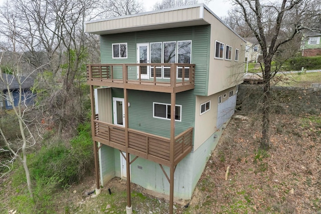 rear view of property with a garage