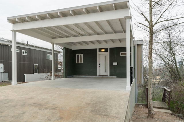 exterior space with a carport and driveway