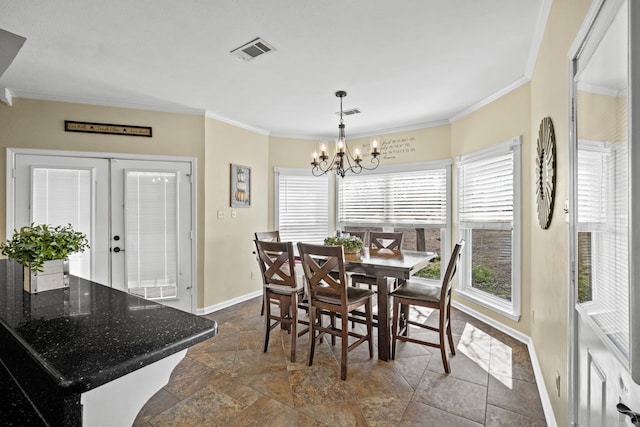 dining room with french doors, visible vents, a chandelier, and ornamental molding