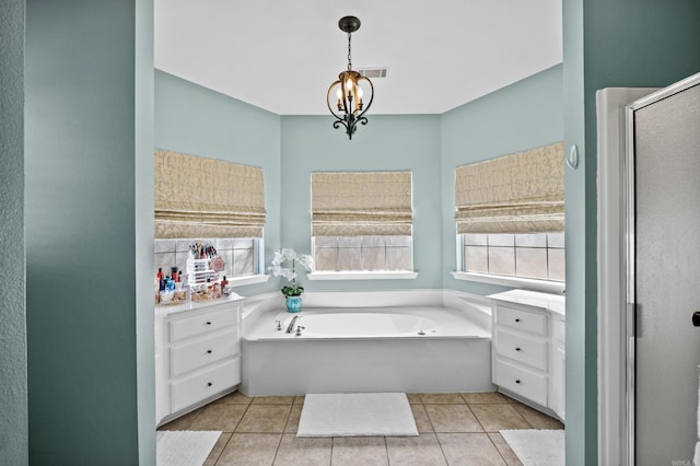 bathroom featuring visible vents, tile patterned floors, a chandelier, a stall shower, and a bath