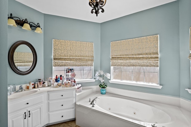 full bathroom featuring vanity and a whirlpool tub