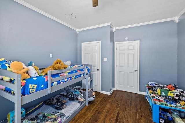 bedroom featuring a ceiling fan, crown molding, wood finished floors, and baseboards