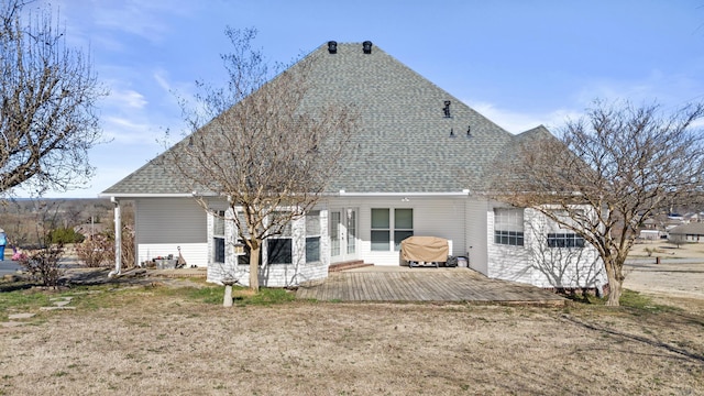 back of property featuring french doors, a shingled roof, and a deck