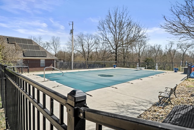 view of pool with a fenced in pool, fence, and a patio area