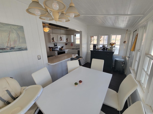 dining area with wood ceiling and vaulted ceiling