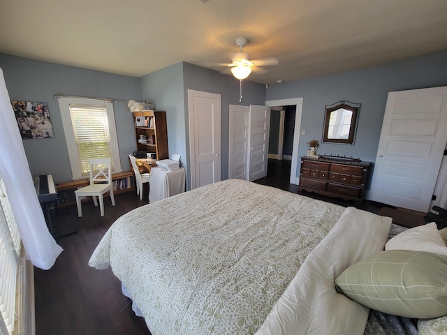 bedroom with a closet, dark wood-type flooring, and ceiling fan