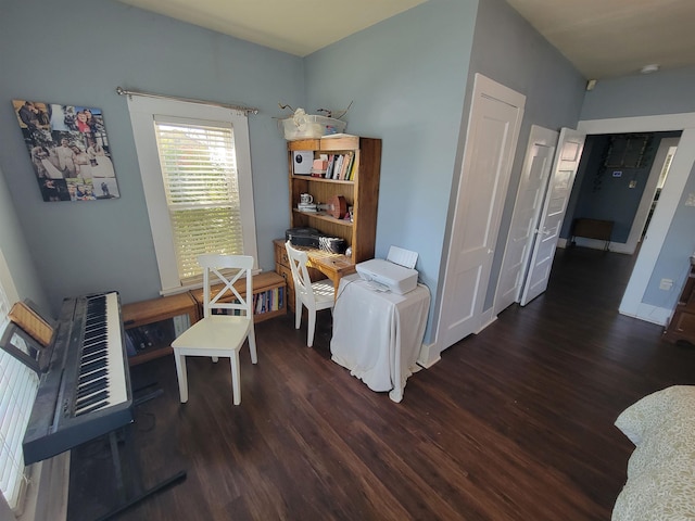 office area with baseboards and wood finished floors