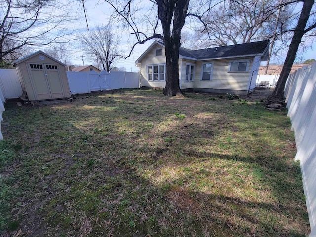 view of yard featuring an outdoor structure, a storage shed, and a fenced backyard