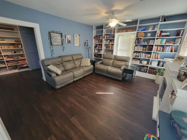 living room featuring wood finished floors and a ceiling fan