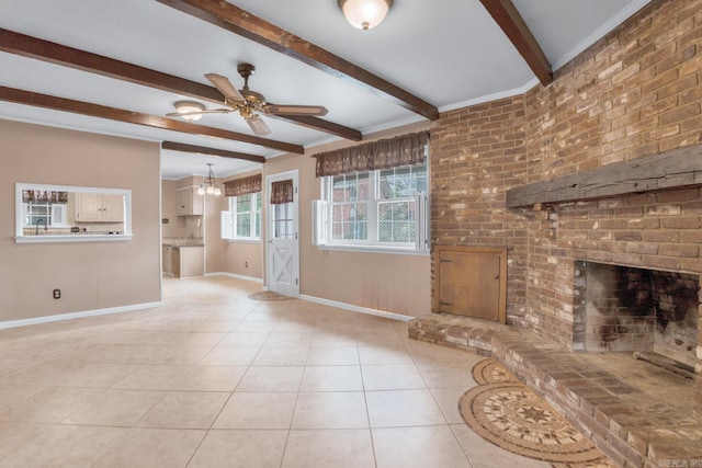 unfurnished living room with beamed ceiling, ceiling fan with notable chandelier, light tile patterned flooring, a fireplace, and baseboards