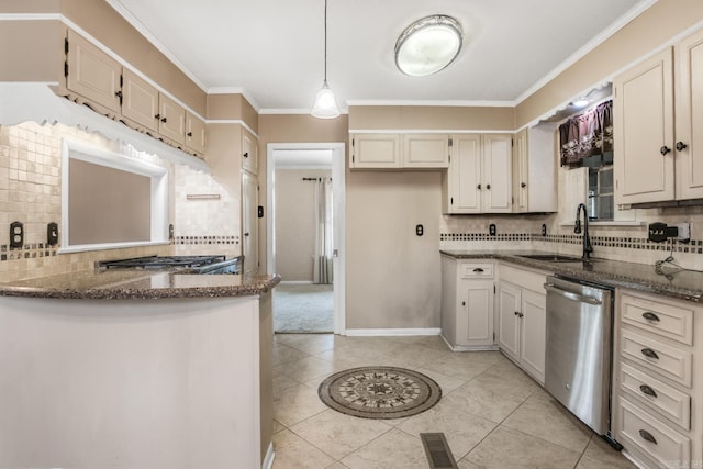 kitchen with visible vents, ornamental molding, dark stone countertops, stainless steel dishwasher, and a sink