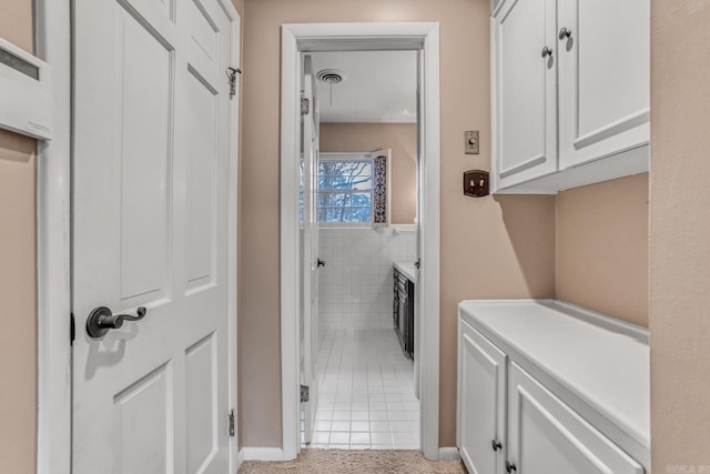 bathroom with tile walls and visible vents