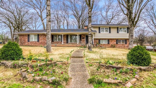 split level home featuring brick siding and crawl space