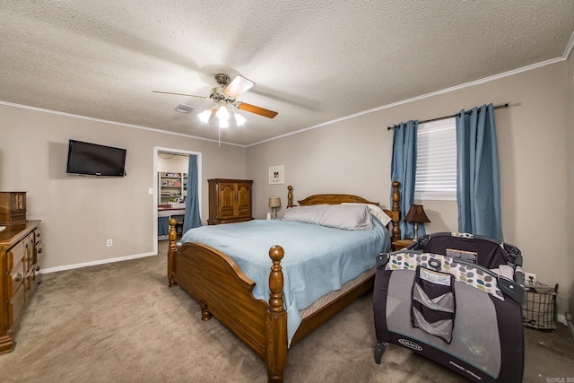 bedroom featuring visible vents, a textured ceiling, carpet, and ornamental molding