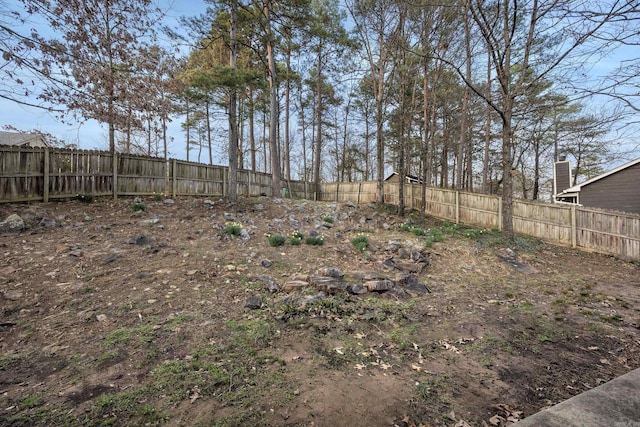 view of yard with a fenced backyard