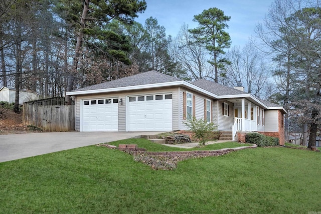 ranch-style home with roof with shingles, driveway, an attached garage, a chimney, and a front lawn