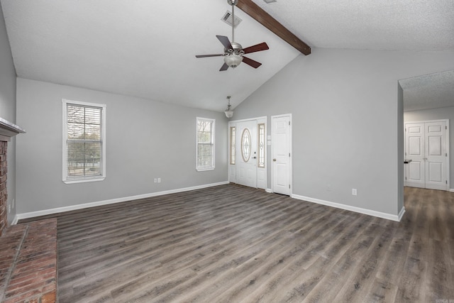 unfurnished living room with visible vents, baseboards, beamed ceiling, wood finished floors, and a textured ceiling