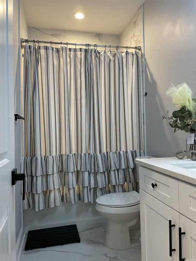 bathroom featuring vanity, toilet, recessed lighting, and marble finish floor