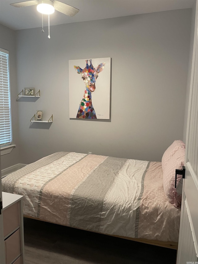 bedroom featuring ceiling fan and wood finished floors