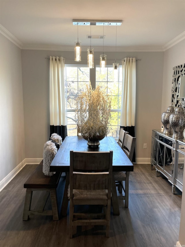 dining room featuring visible vents, baseboards, ornamental molding, and dark wood-style flooring